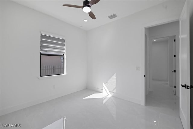 spare room featuring ceiling fan