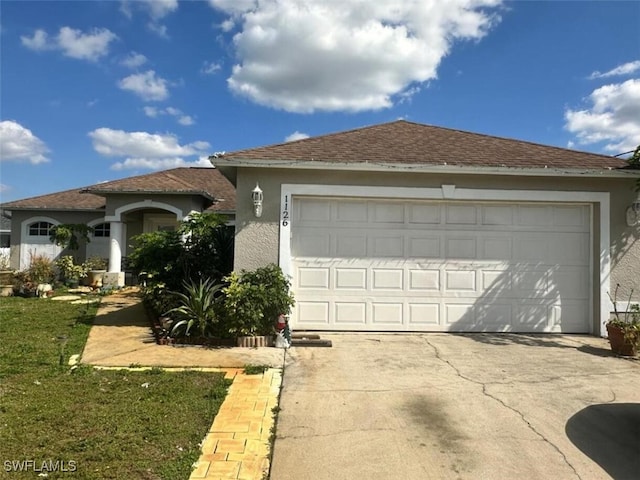 single story home featuring stucco siding, concrete driveway, and roof with shingles