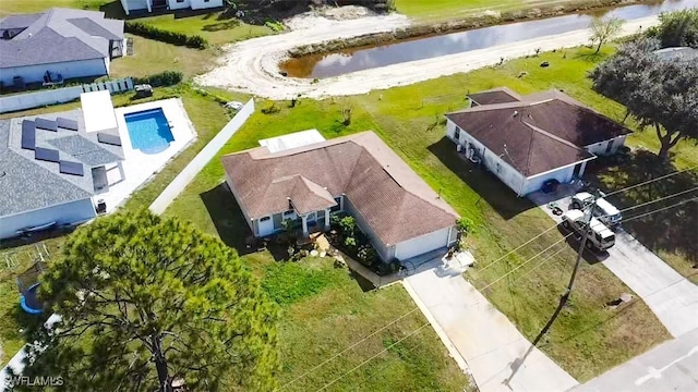 drone / aerial view with a water view