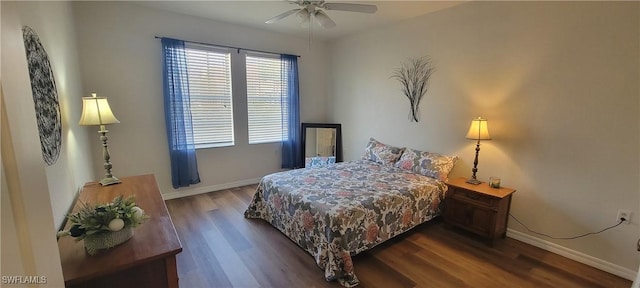 bedroom featuring ceiling fan and dark hardwood / wood-style floors