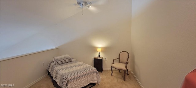 bedroom featuring a ceiling fan, light colored carpet, and baseboards