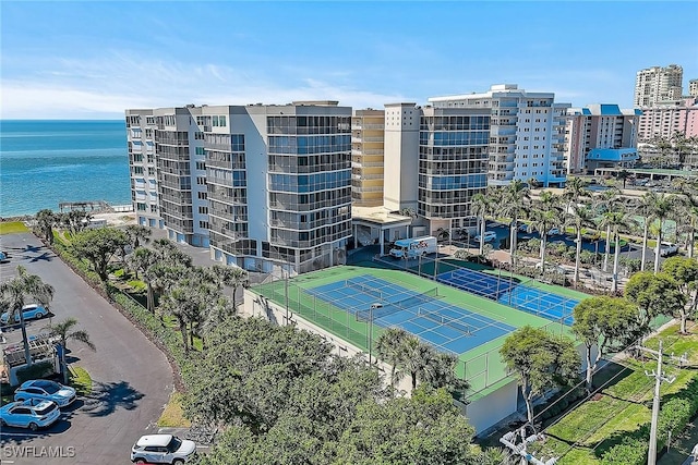 birds eye view of property with a water view