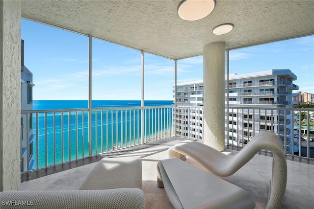 balcony featuring a water view