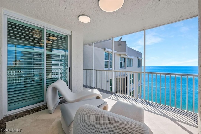 balcony featuring a water view