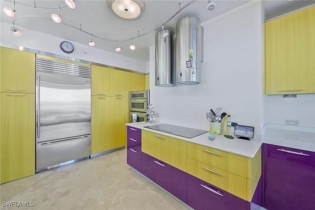 kitchen featuring stainless steel appliances and exhaust hood