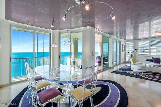 dining area featuring a water view