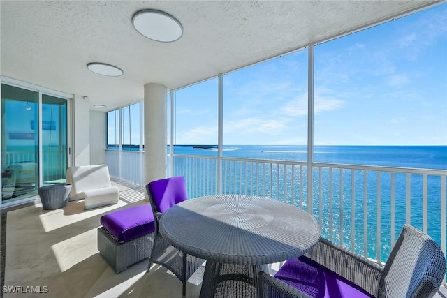 sunroom with a water view