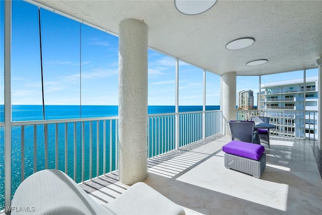 balcony featuring a water view