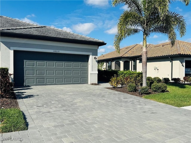 view of front of property with a garage