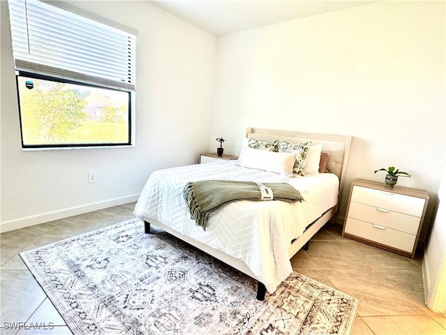 bedroom with light tile patterned flooring