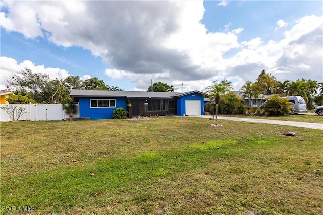 single story home featuring driveway, an attached garage, a front lawn, and fence