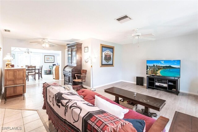 living room featuring ceiling fan and light wood-type flooring