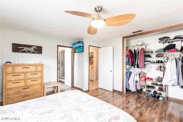 bedroom with hardwood / wood-style flooring, ceiling fan, and a closet