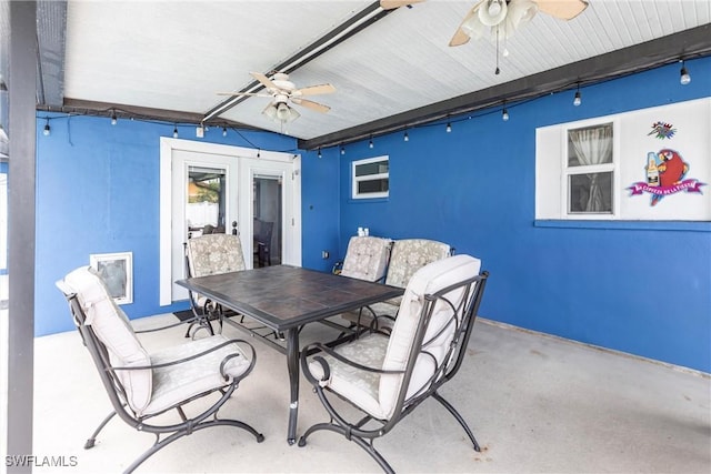 view of patio with outdoor dining space and ceiling fan