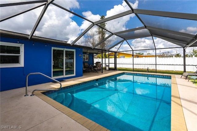 view of pool featuring a lanai and a patio