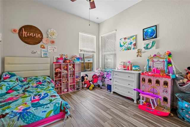 bedroom with ceiling fan and light hardwood / wood-style flooring