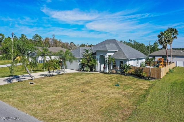 view of front of home featuring a garage and a front yard