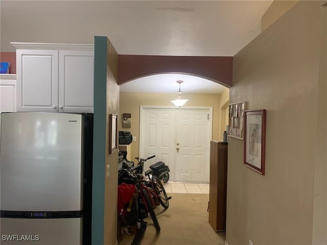 hallway with light tile patterned floors