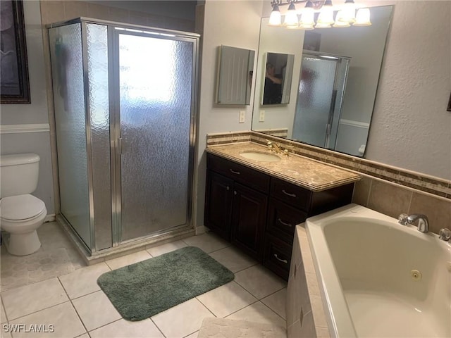 full bathroom with toilet, vanity, plus walk in shower, and tile patterned flooring