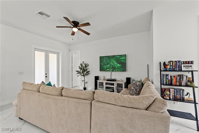 living room with french doors and ceiling fan