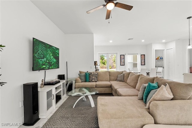 living room featuring french doors and ceiling fan