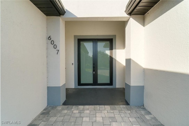 entrance to property featuring french doors