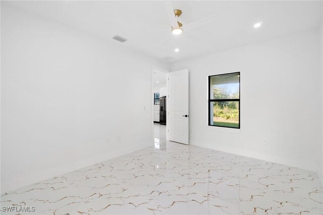 unfurnished room with ceiling fan