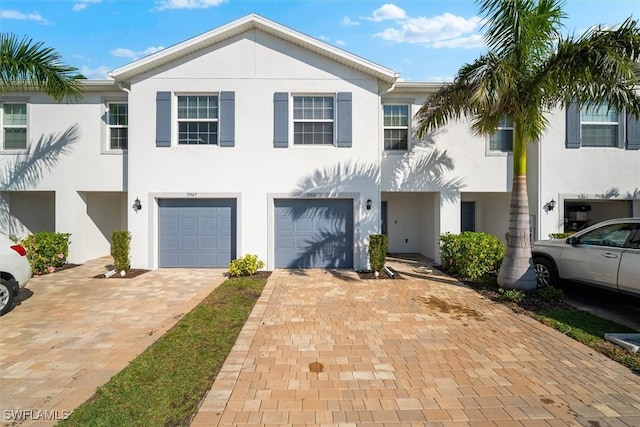 townhome / multi-family property featuring a garage