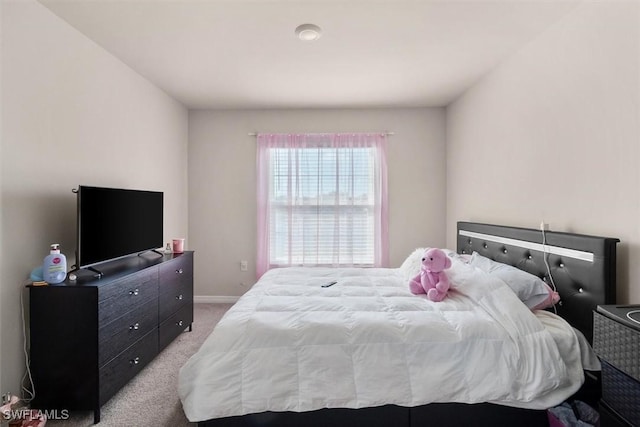 bedroom featuring light colored carpet