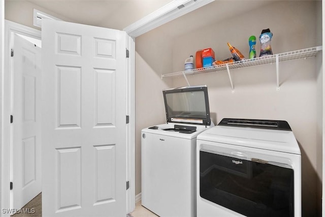 washroom featuring independent washer and dryer