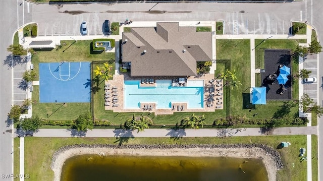 birds eye view of property with a water view