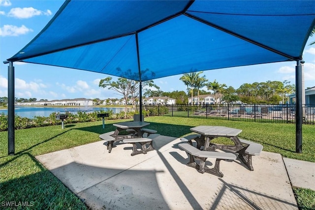 view of patio featuring a water view