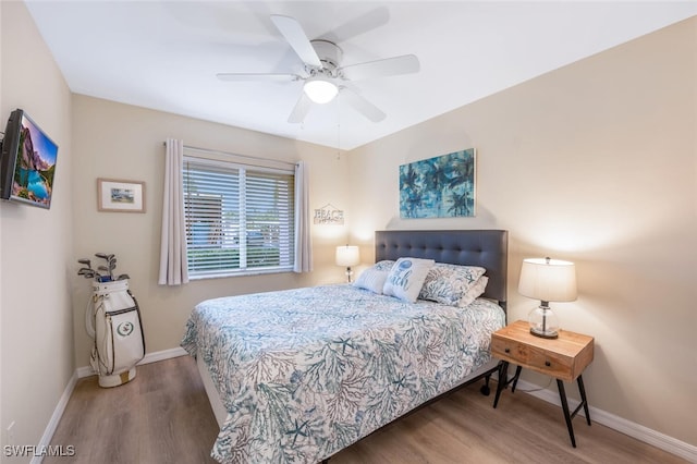 bedroom featuring ceiling fan and wood-type flooring