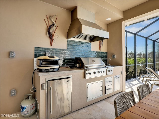 view of patio with an outdoor kitchen, area for grilling, and a lanai