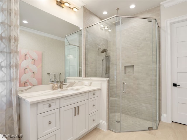 bathroom featuring crown molding, an enclosed shower, and vanity