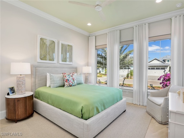 bedroom with ornamental molding and ceiling fan