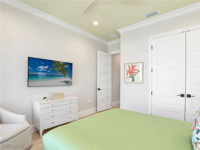 bedroom featuring ornamental molding and a closet