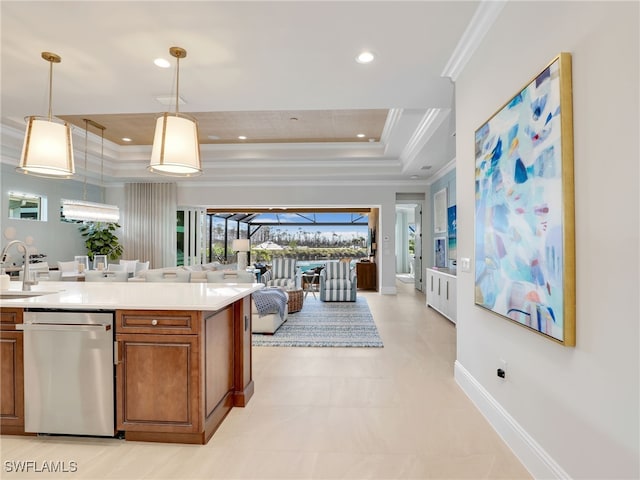 kitchen with sink, hanging light fixtures, ornamental molding, dishwasher, and a raised ceiling