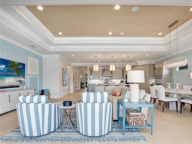 living room featuring light tile patterned floors, crown molding, and a raised ceiling