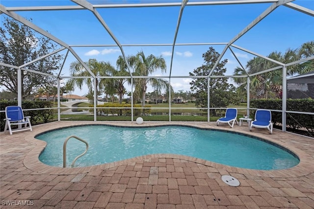 view of swimming pool with a lanai and a patio area