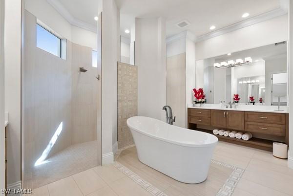 bathroom with crown molding, shower with separate bathtub, and tile patterned flooring