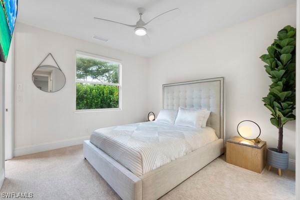 carpeted bedroom with ceiling fan