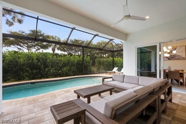 view of swimming pool with an outdoor living space and a patio area