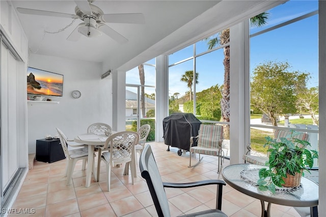 sunroom / solarium with a wealth of natural light and ceiling fan