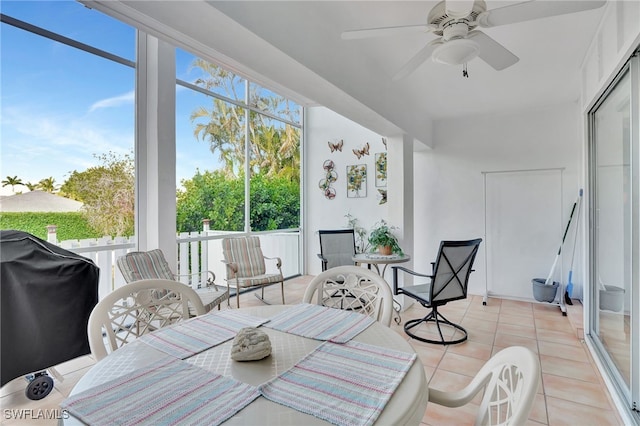 sunroom featuring ceiling fan