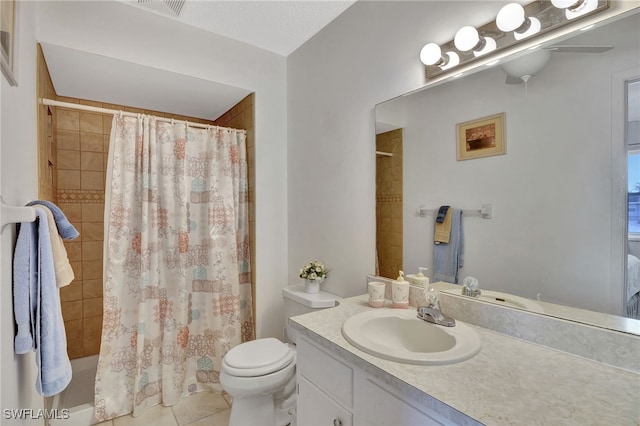 full bathroom featuring shower / bathtub combination with curtain, tile patterned floors, vanity, and toilet