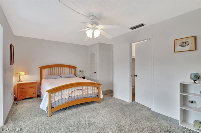 bedroom featuring ceiling fan and carpet