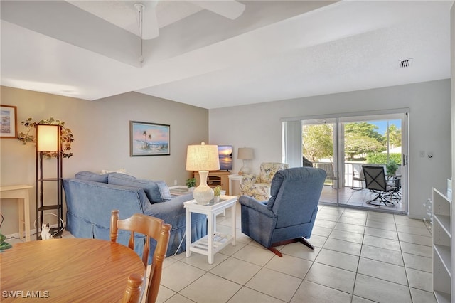 living room featuring light tile patterned floors, visible vents, and a ceiling fan