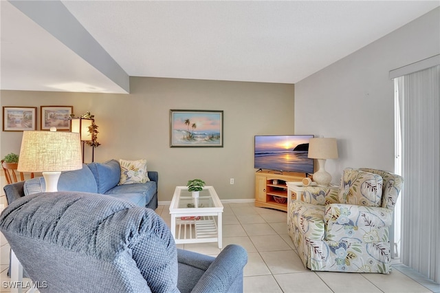 living area with light tile patterned flooring and baseboards