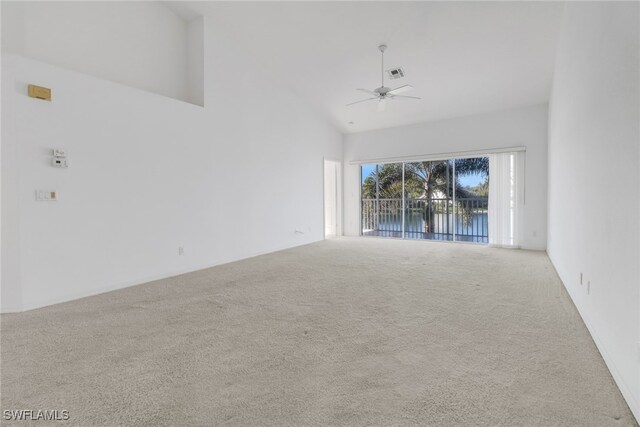 1040 Partridge Cir Unit 201, Naples, FL 34104 - carpeted empty room with high vaulted ceiling and ceiling fan